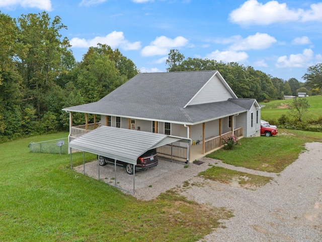 view of front of home with a front lawn and a carport