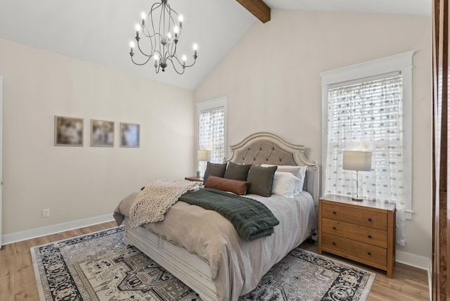 bedroom featuring a notable chandelier, lofted ceiling with beams, and light wood-type flooring