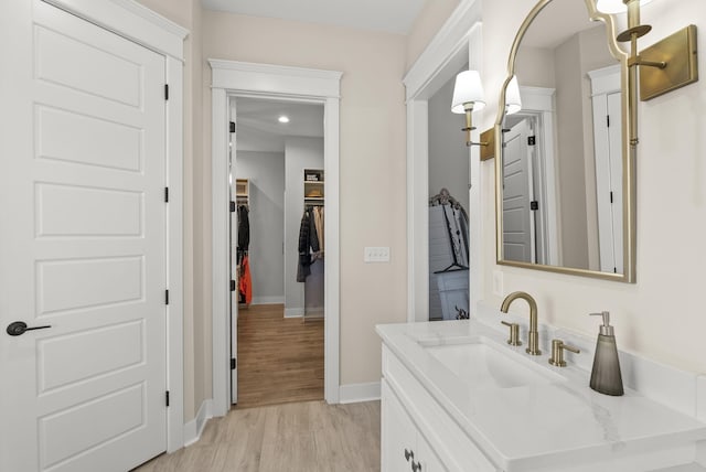 bathroom with vanity and hardwood / wood-style floors