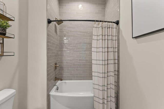 bathroom with shower / bath combination with curtain and toilet