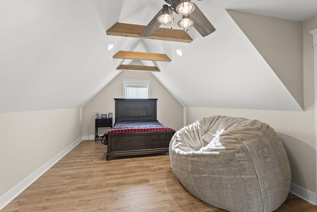 bedroom featuring lofted ceiling, light wood-type flooring, and ceiling fan