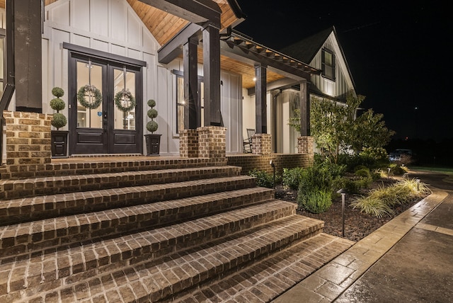 view of exterior entry featuring french doors