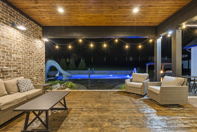 exterior space featuring a water slide and an outdoor hangout area