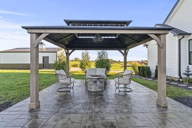 view of patio featuring a gazebo and an outdoor fire pit