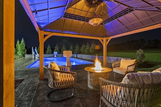 view of patio / terrace with a gazebo and an outdoor fire pit