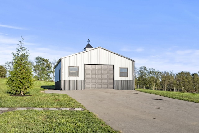 garage featuring a yard