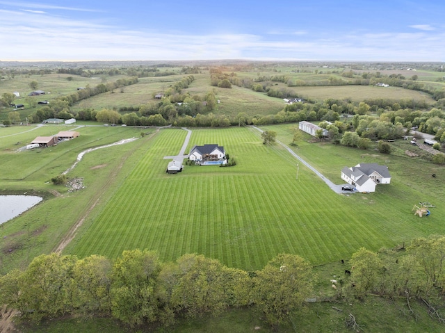 birds eye view of property featuring a rural view