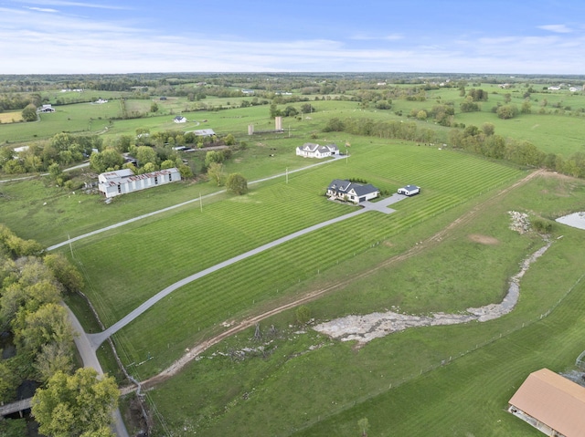 birds eye view of property featuring a rural view