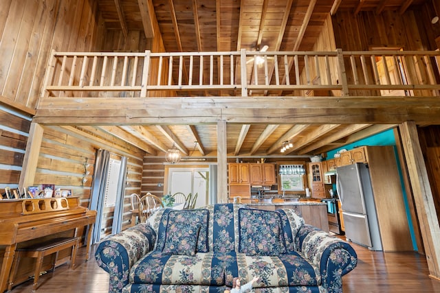 living room with wooden ceiling, ceiling fan, beamed ceiling, and hardwood / wood-style flooring