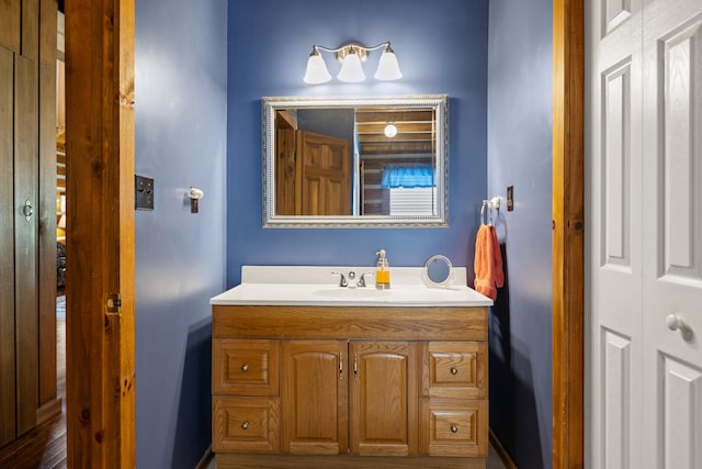 bathroom featuring wood-type flooring and vanity