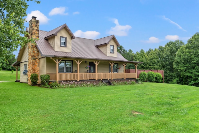 view of front of property featuring a front lawn and covered porch