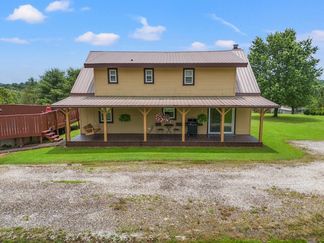 view of front of property featuring a front lawn and covered porch