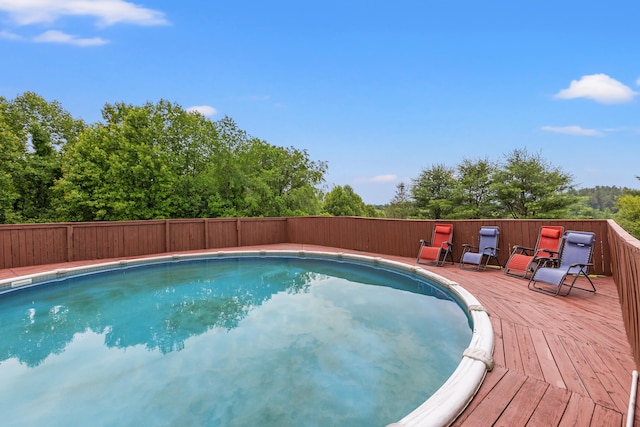 view of pool featuring a wooden deck