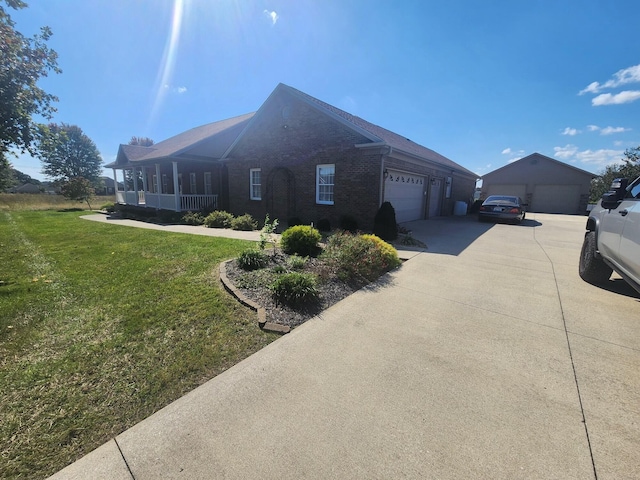 view of home's exterior with a yard and a garage