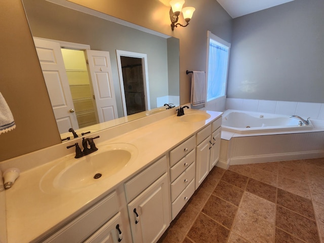 bathroom with a bath and vanity