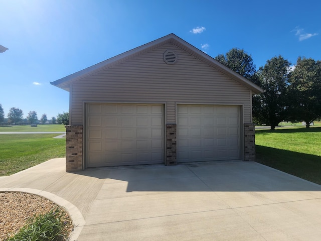 garage featuring a yard