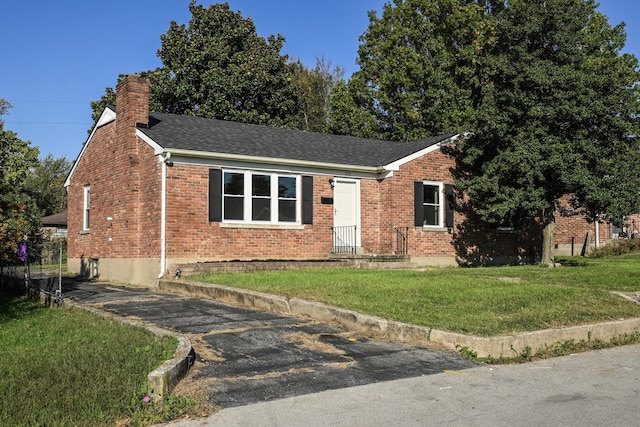 view of front of home with a front yard