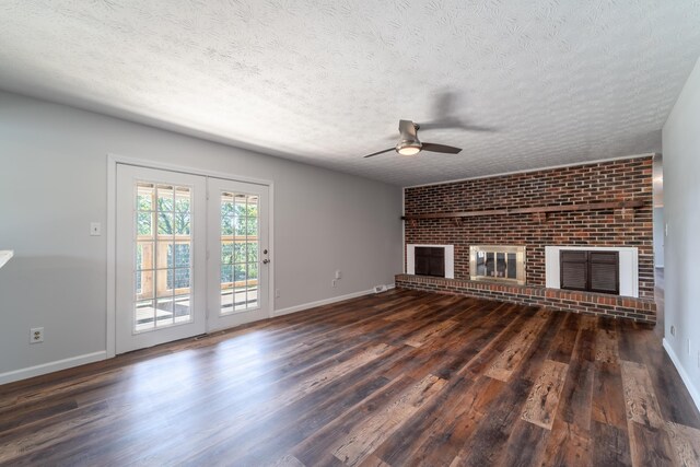 empty room featuring dark hardwood / wood-style flooring and a textured ceiling