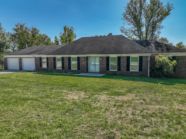 ranch-style home featuring a garage, concrete driveway, roof with shingles, a front lawn, and brick siding