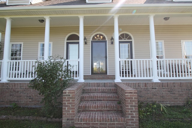 doorway to property with a porch