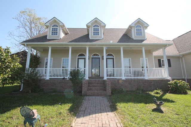 view of front facade featuring a front lawn and covered porch