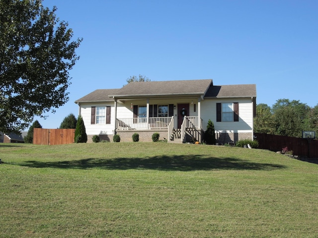 ranch-style home featuring a front lawn and a porch