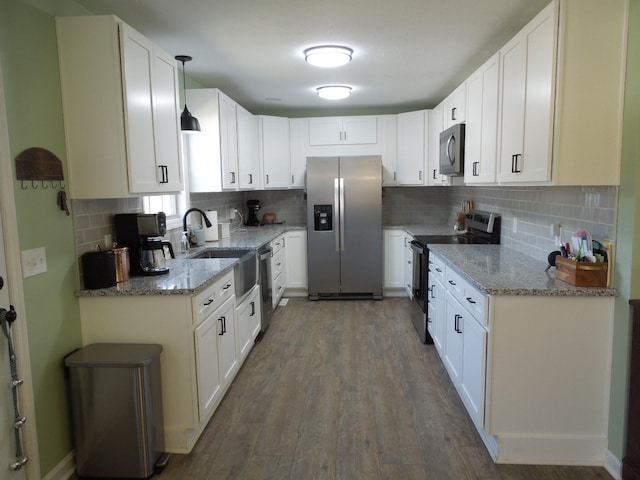 kitchen featuring appliances with stainless steel finishes and white cabinets