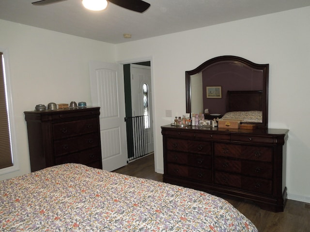 bedroom with dark wood-style flooring and ceiling fan