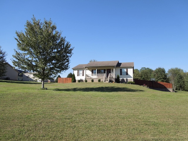 view of front of property with a porch and a front yard