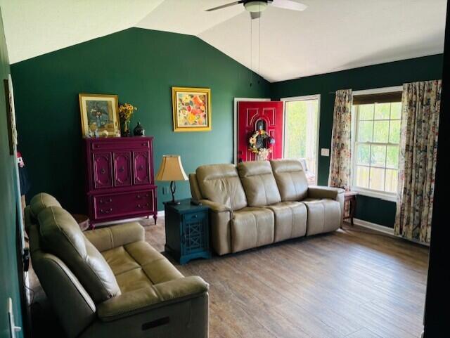 222 Elm Loop, Hustonville, KY 40437 - living room with baseboards, wood finished floors, a ceiling fan, and vaulted ceiling