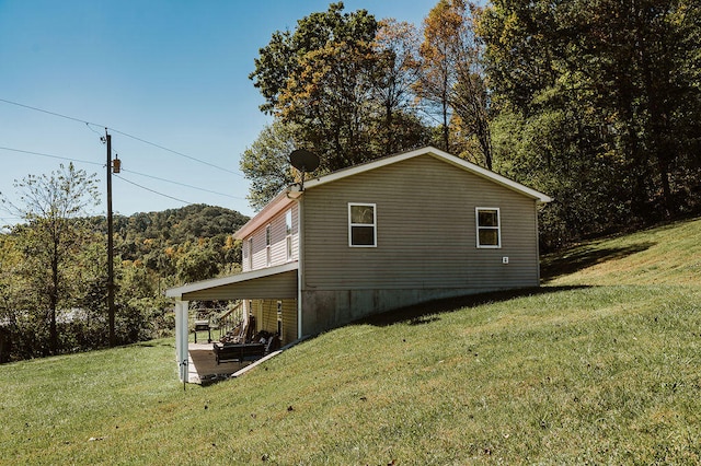 view of property exterior featuring a yard