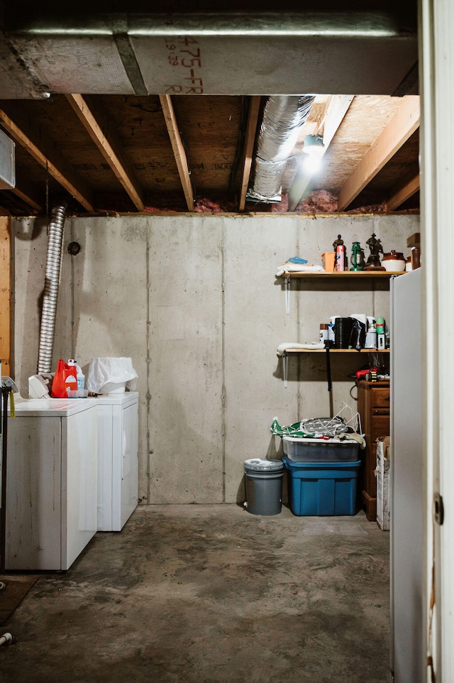 basement with washing machine and clothes dryer