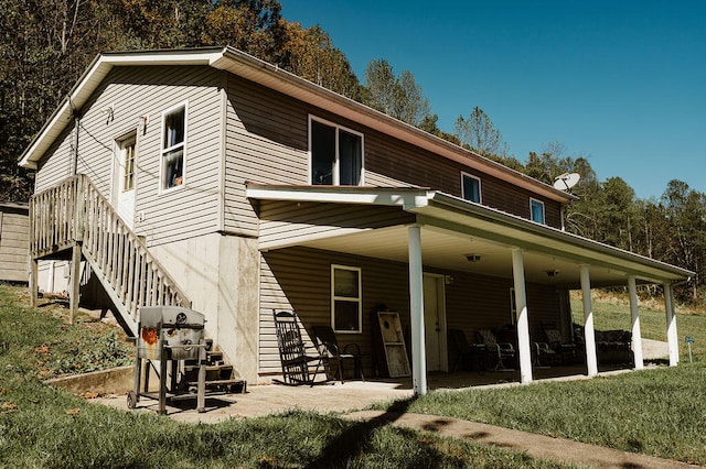 back of property featuring a patio area