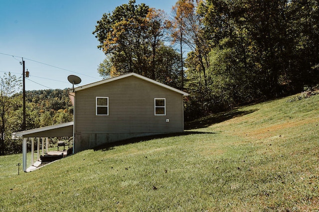 view of home's exterior with a lawn