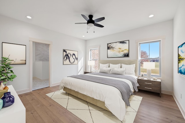 bedroom featuring light hardwood / wood-style floors and ceiling fan