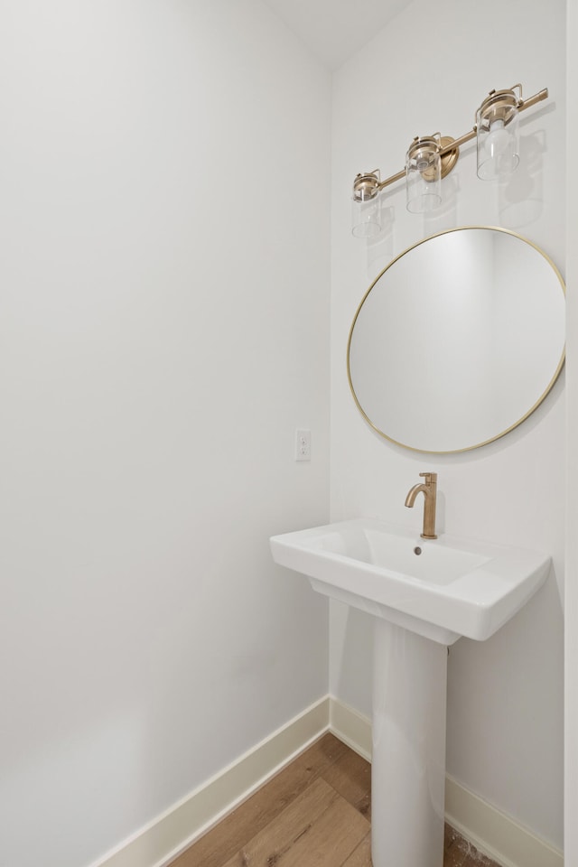 bathroom featuring sink and wood-type flooring