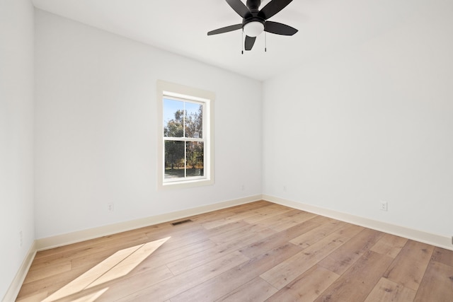 spare room with light hardwood / wood-style floors and ceiling fan