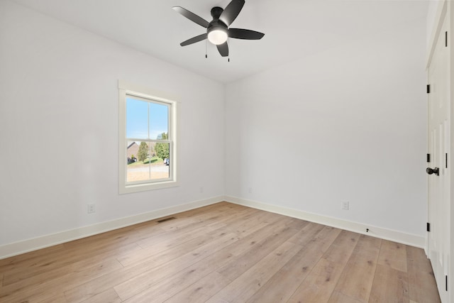 spare room with light hardwood / wood-style floors and ceiling fan