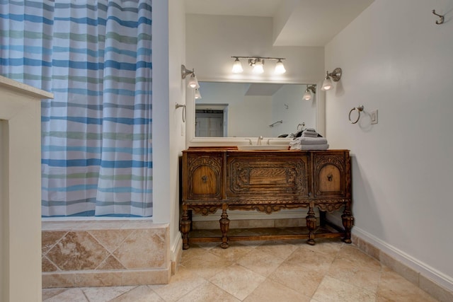 bathroom with a shower with curtain and vanity