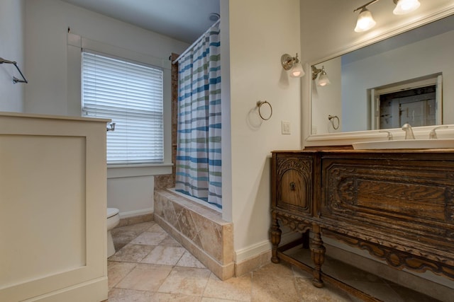 full bathroom with vanity, toilet, and shower / tub combo