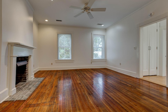 unfurnished living room featuring a fireplace, hardwood / wood-style flooring, and ornamental molding