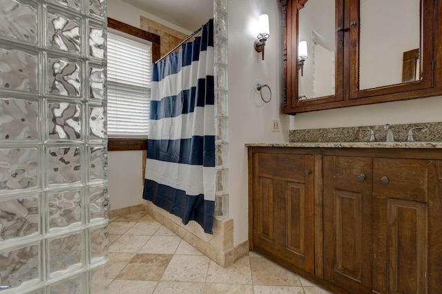 bathroom with vanity and a shower with shower curtain