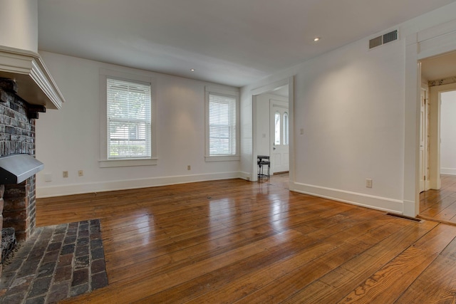 unfurnished living room featuring hardwood / wood-style floors