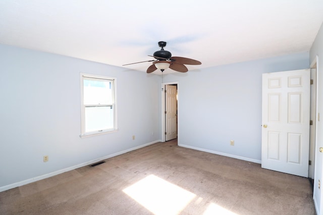 unfurnished bedroom featuring visible vents, carpet, ceiling fan, and baseboards