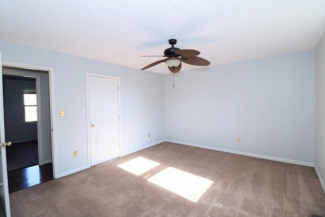 unfurnished bedroom featuring baseboards, carpet, and ceiling fan