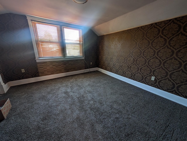 bonus room featuring carpet and lofted ceiling