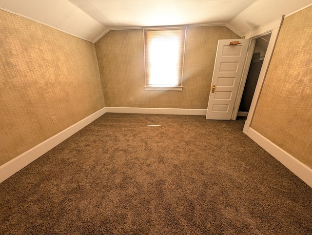 bonus room with carpet and lofted ceiling