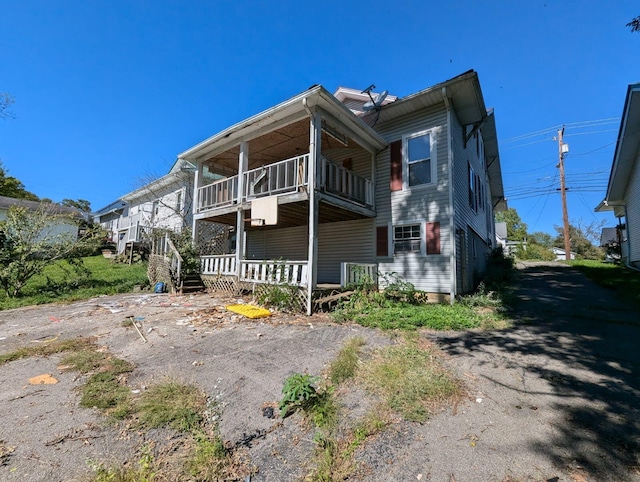 exterior space featuring a porch and a balcony