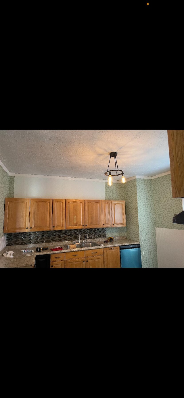 kitchen featuring dishwasher and sink