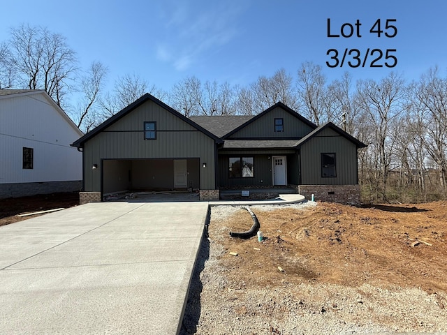 modern farmhouse with crawl space, driveway, a shingled roof, and an attached garage